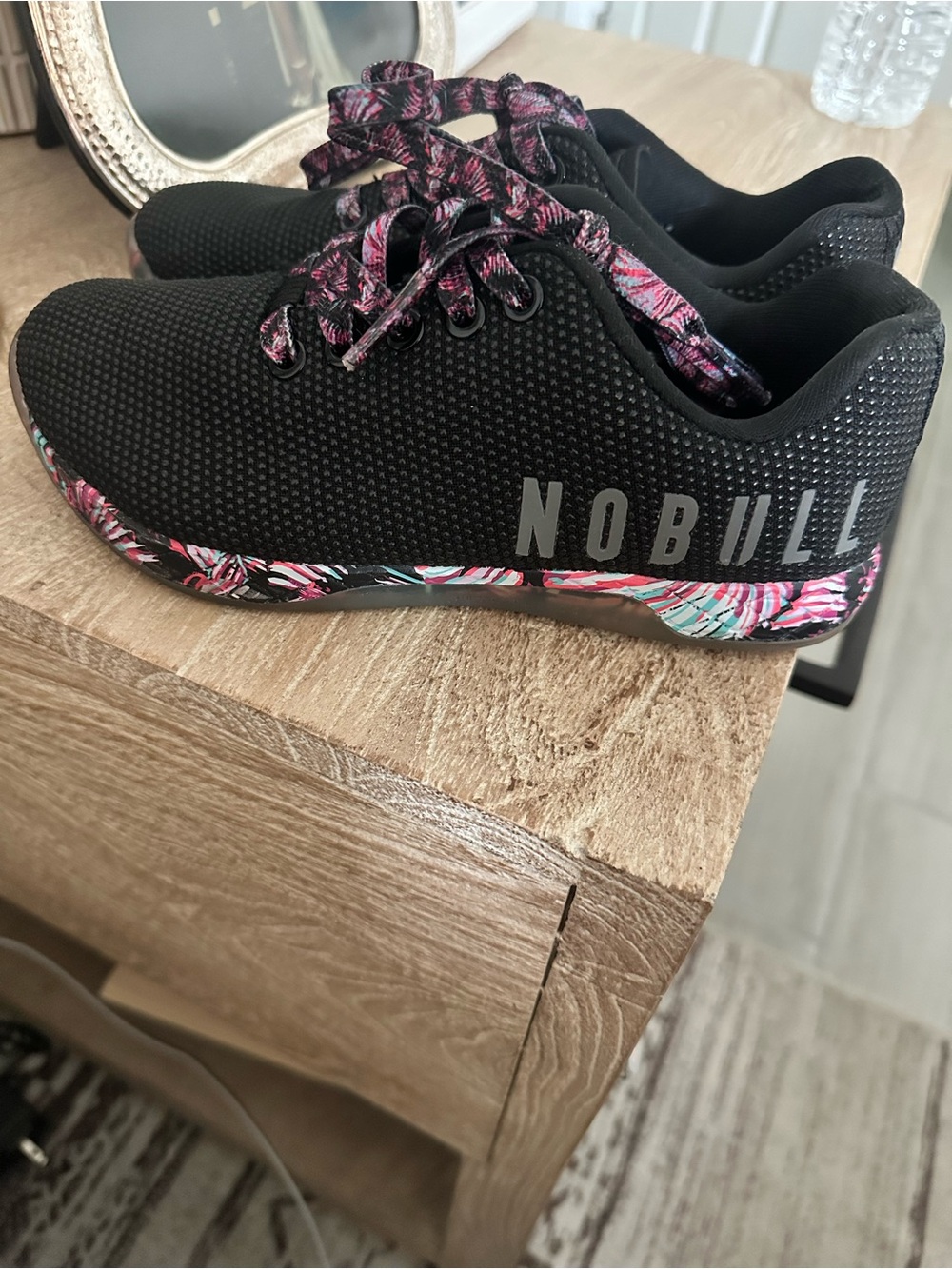 NOBULL Black Trainers with Pink and Teal Floral Accents